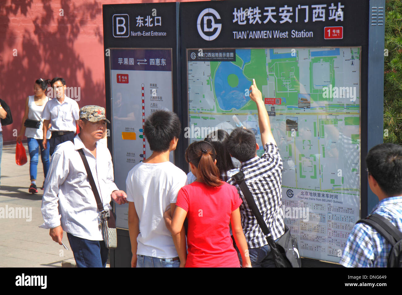 Beijing China,Chinese,Tian'anmen West Subway Station,Line 1,sign,information,street,map,Chinese characters hànzì pinyin,Asian man men male,pointing,Ch Stock Photo