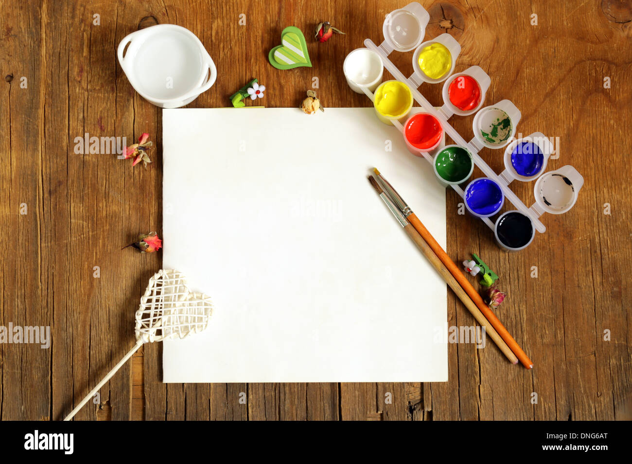 painting set - brushes, paints (gouache) on old wooden table Stock Photo
