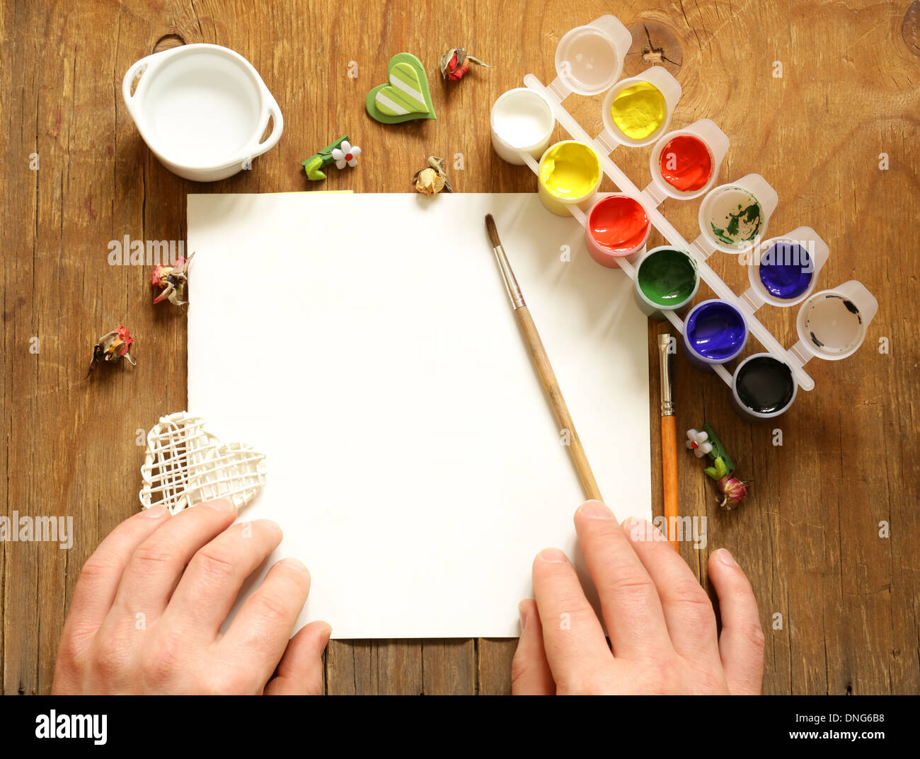 painting set - brushes, paints (gouache) on old wooden table Stock Photo