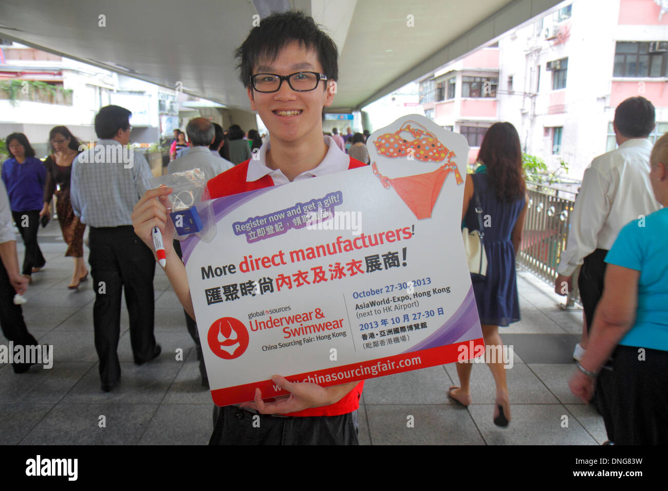 Hong Kong China,HK,Asia,Chinese,Oriental,Island,Wan Chai,Hennessy Road,raised pedestrian walkway,Asian man men male,holding poster,ad,advertising,Cant Stock Photo