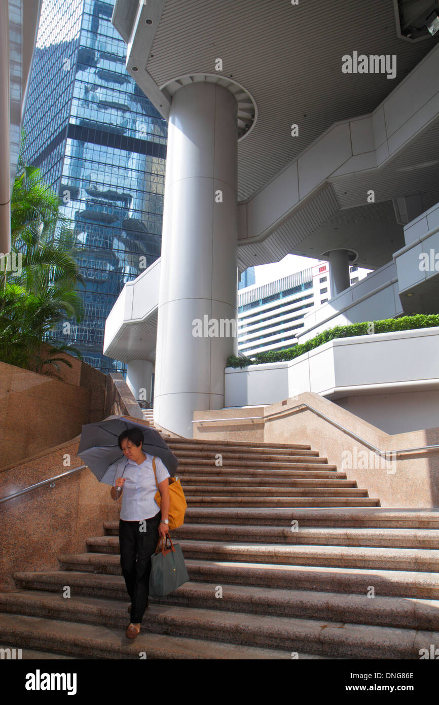 Hong Kong China,HK,Asia,Chinese,Oriental,Island,Admiralty,Lippo Centre,center,urban,architecture columns,steps stairs staircase,Asian adult,adults,wom Stock Photo