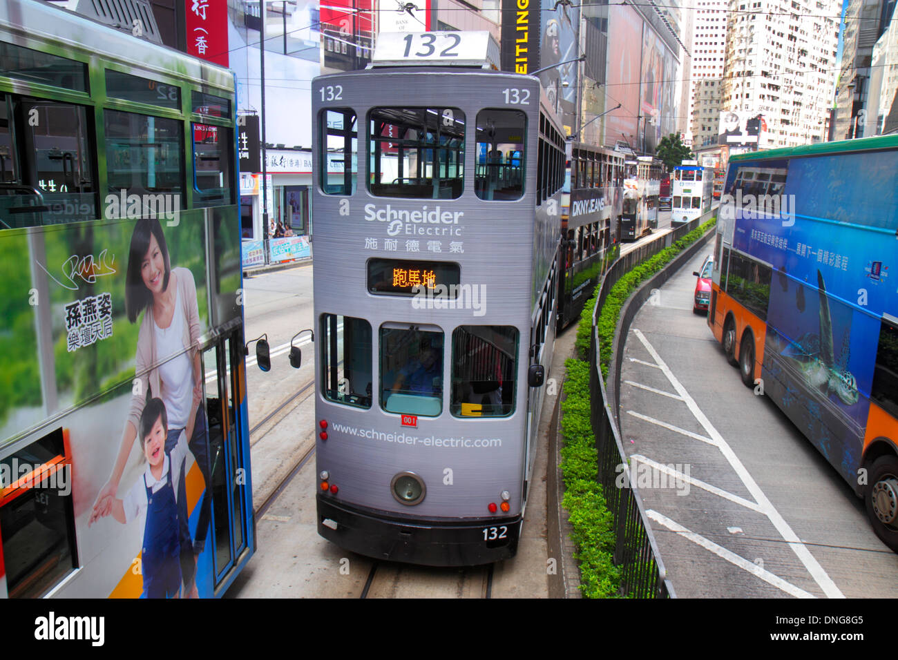 Hong Kong China,HK,Asia,Chinese,Oriental,Island,Causeway Bay,Yee Wo Street,double decker tram Tramways,businesses,district,buildings,city skyline,Cant Stock Photo