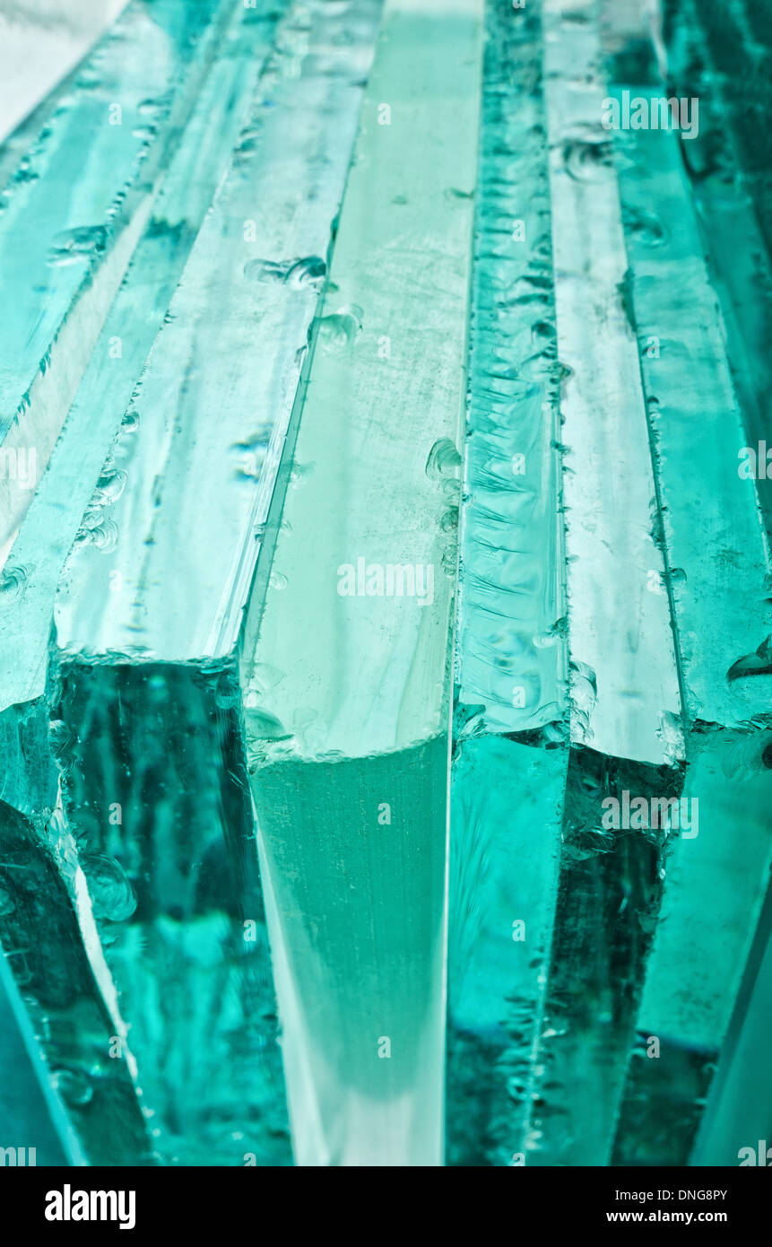 Sharp dangerous edge of plate glass internal reflection brings out green color and depth Stock