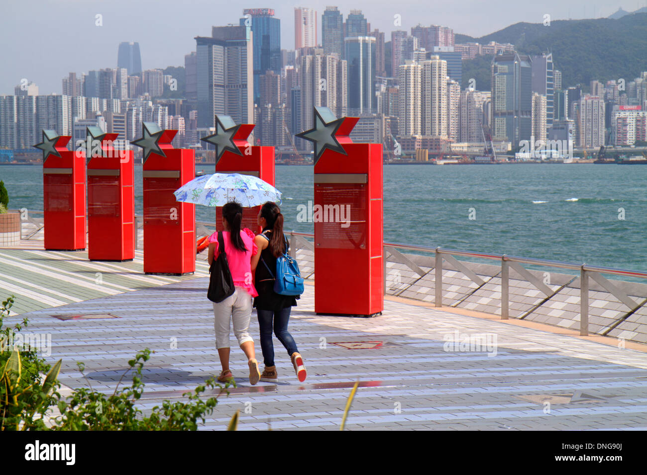 Hong Kong China,HK,Asia,Chinese,Oriental,Kowloon,Tsim Sha Tsui,Avenue of the Stars,Victoria Harbour,harbor,waterfront promenade,Asian adult,adults,wom Stock Photo