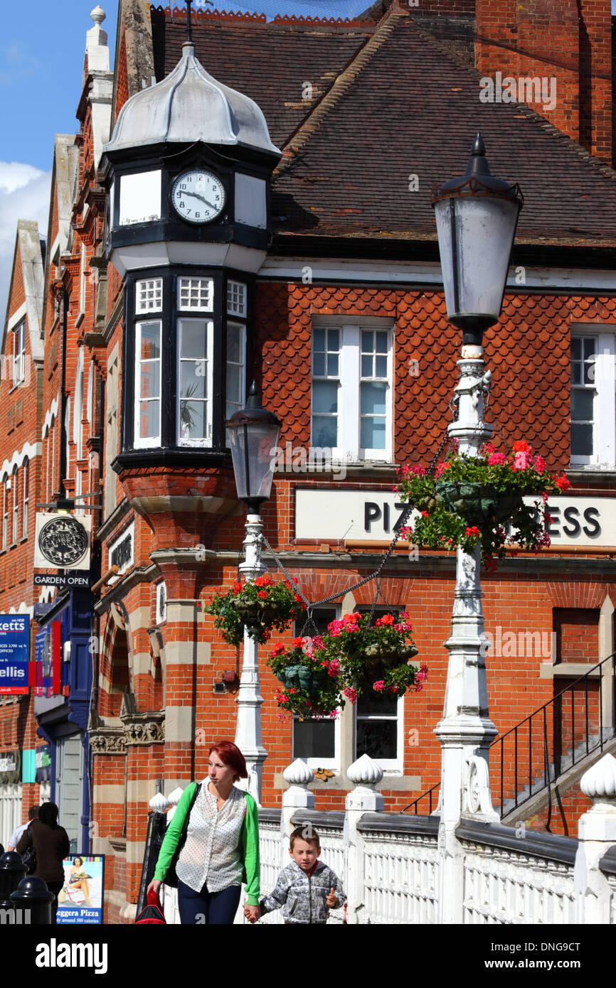 Clock tower on Victorian brick building that houses Pizza Express in High Street, Tonbridge, Kent , England Stock Photo