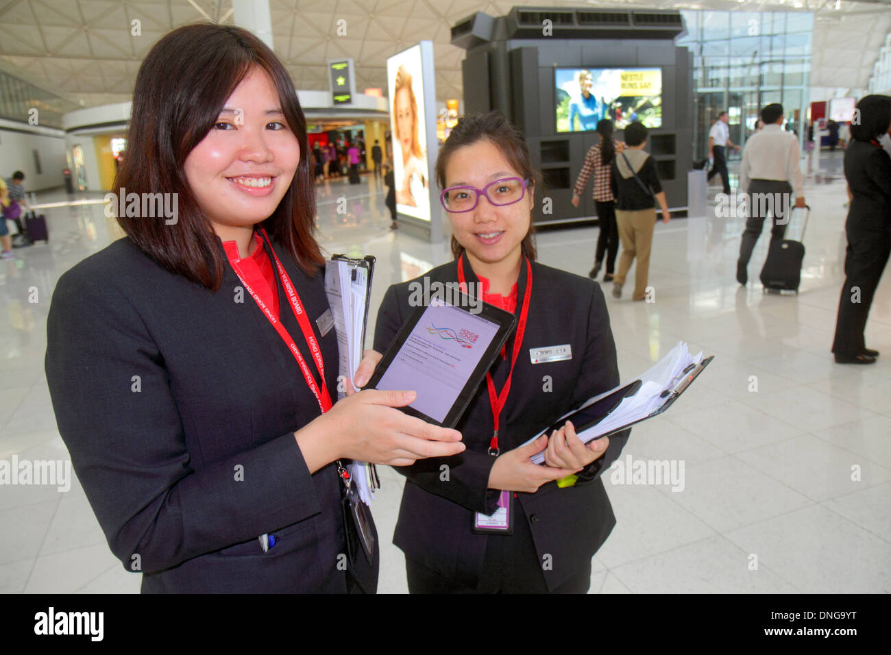 Hong Kong China,HK,Asia,Chinese,Oriental,Chek Lap Kok,Hong Kong International Airport,HKG,Asian adult,adults,woman female women,tourism representative Stock Photo