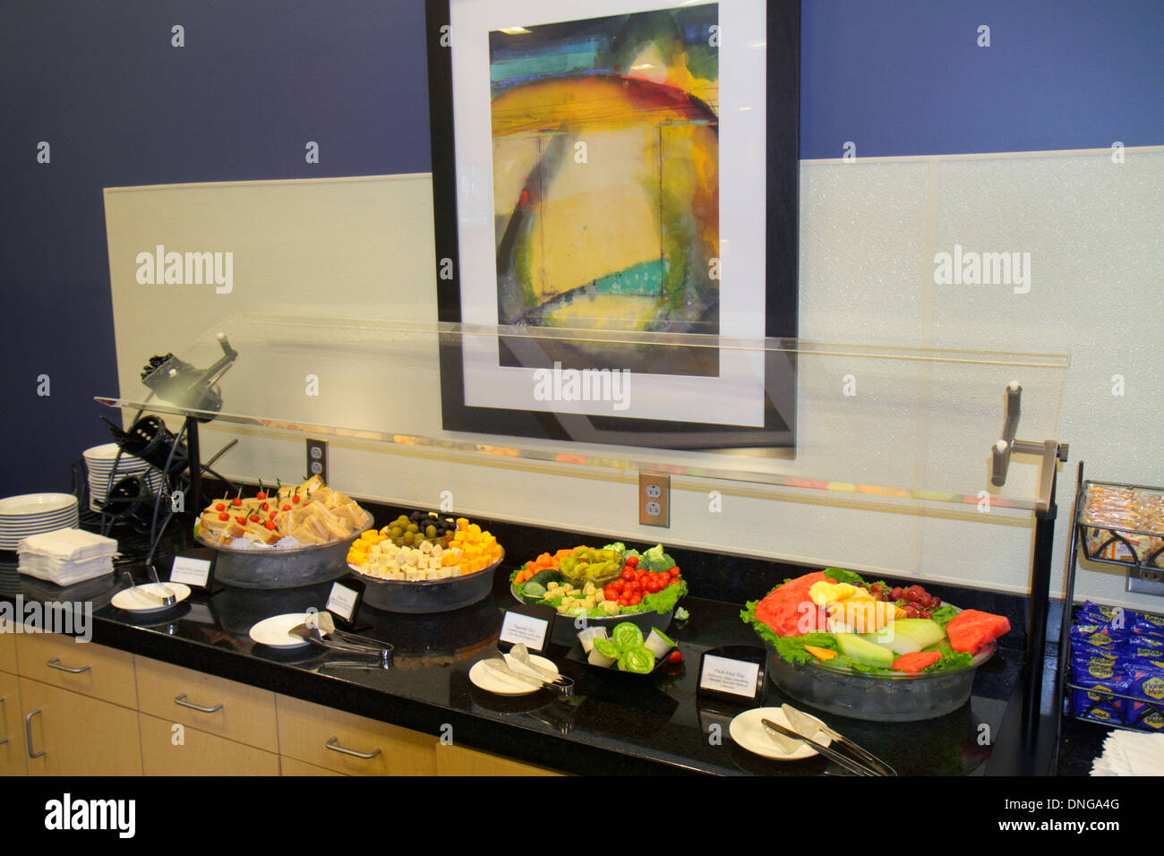 Texas,Houston,TX,Southwest,George Bush Intercontinental Airport,IAH,terminal,gate,Executive Club,airport lounge,class,buffet style table,food,looking Stock Photo