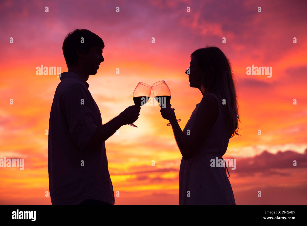 Silhouette couple drinking wine sunset hi-res stock photography and ...