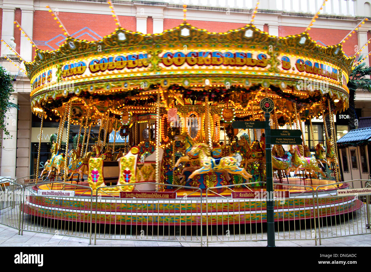 A carousel or merry-go-round amusement ride at Trafford Centre Stock Photo
