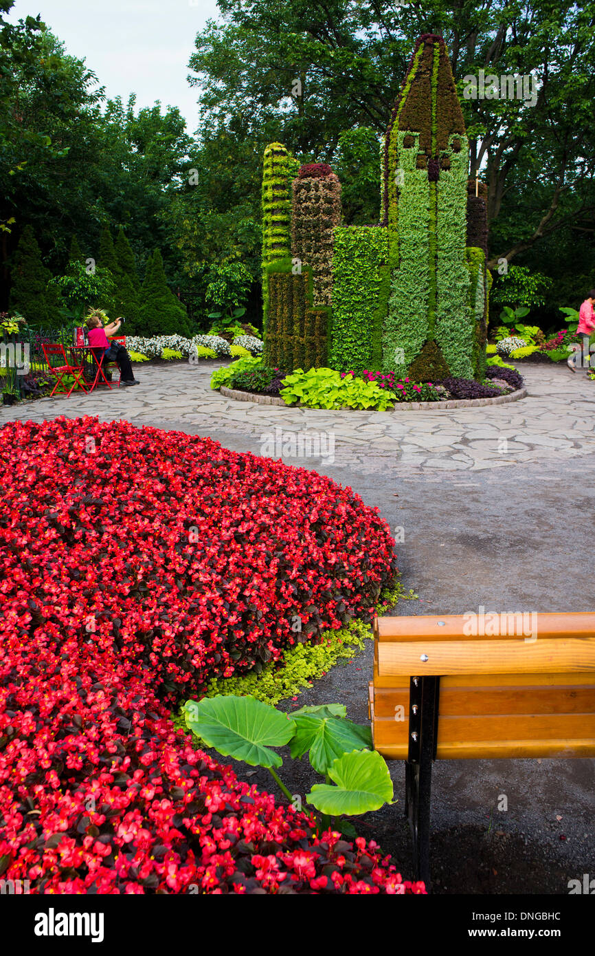 Abench in front of a topiary castle in Montreal Botanical Gardens ...