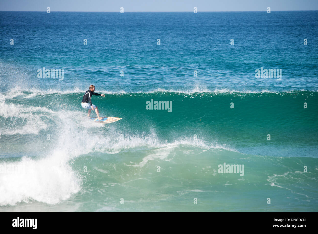 ocean surf photo surfers riding waves Stock Photo - Alamy