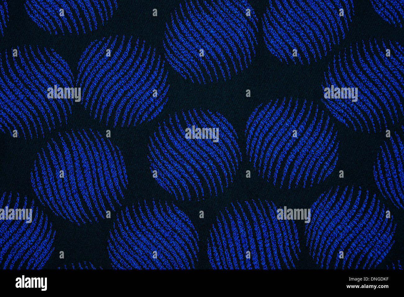 Material in the blue circles, a navy-blue textile background Stock Photo