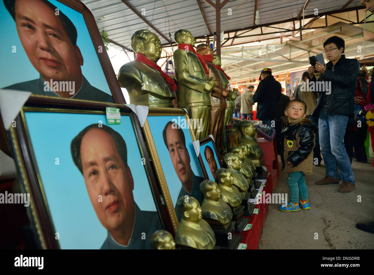 Souvenirs related to Mao Zedong are on sale in Shaoshan, Mao's birthplace, Hunan province, China. 06-Dec-2013 Stock Photo