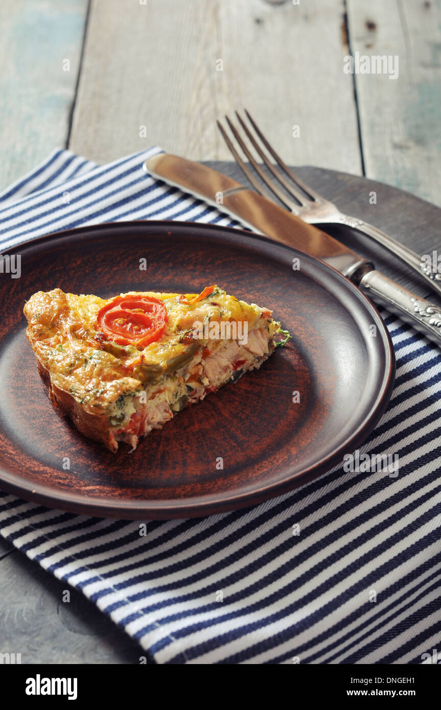 Frittata with Fresh Vegetables and chicken meat on plate Stock Photo