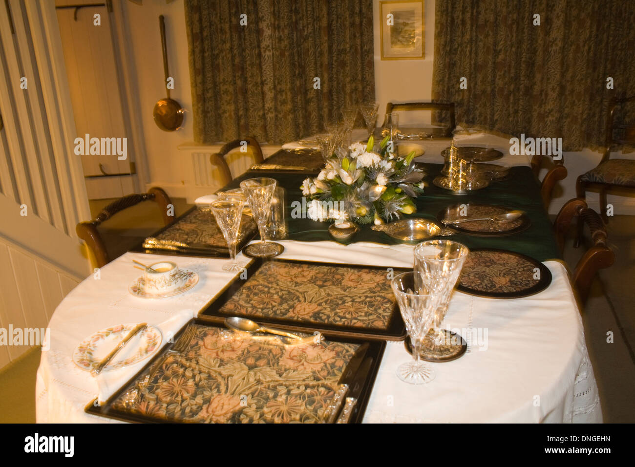 UK Dining room long table with formal setting for dinner for four persons Stock Photo