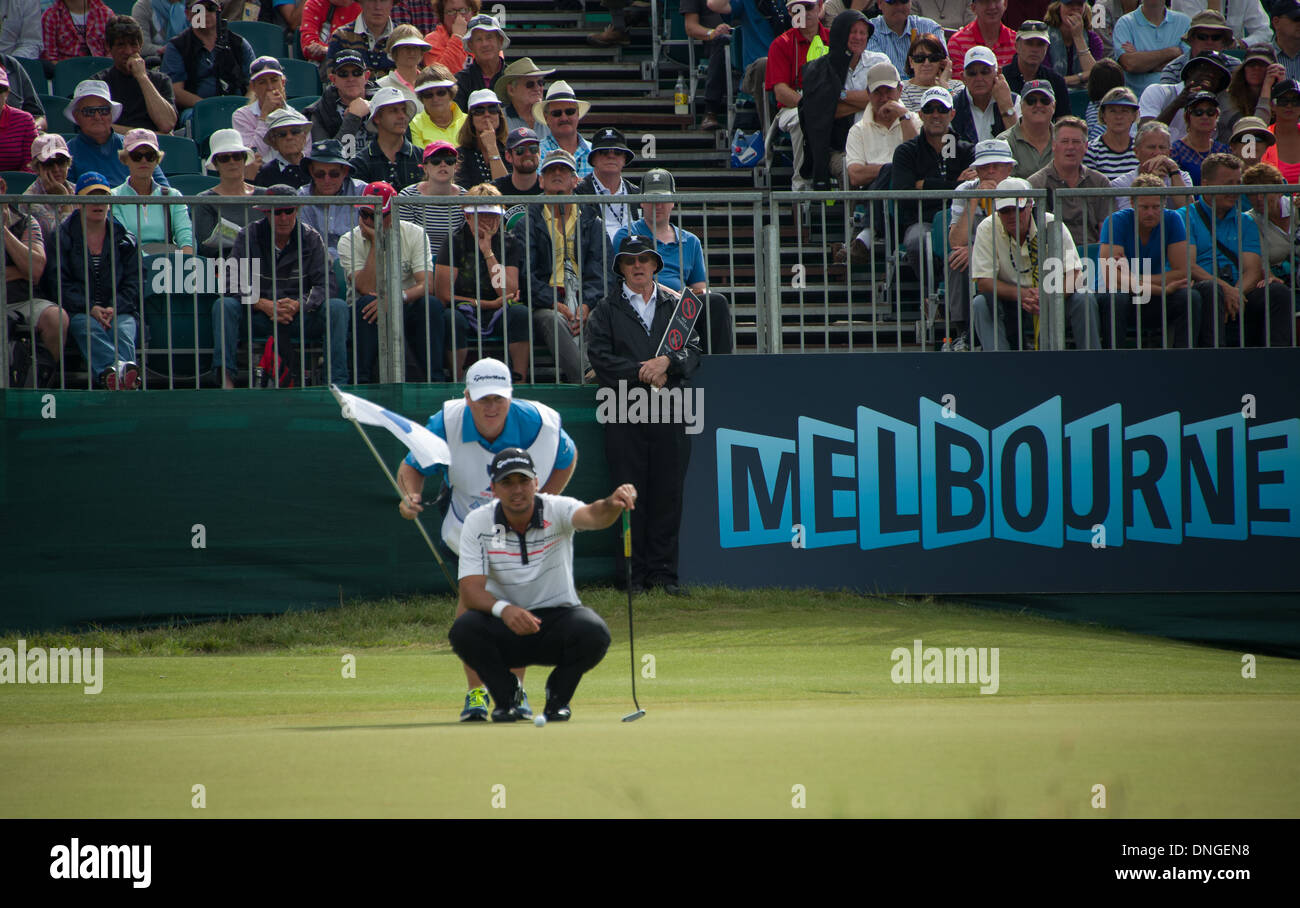 Jason Day world Champion golfer Australia playing in the Handa World Cup 2013 Royal MElbourne on the green putting Stock Photo