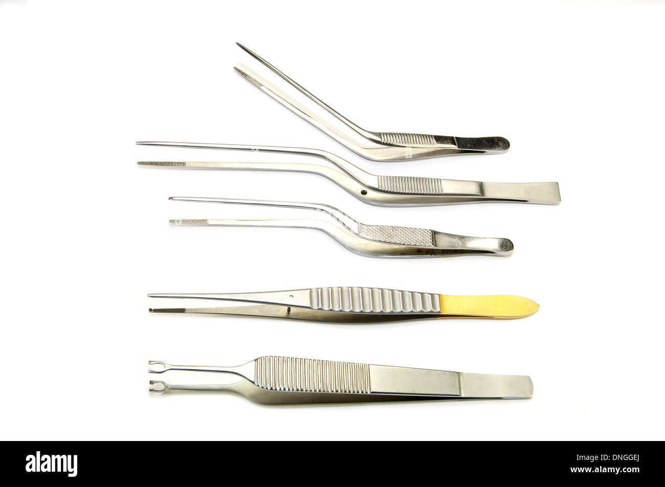 new metal surgical instruments on white background Stock Photo - Alamy