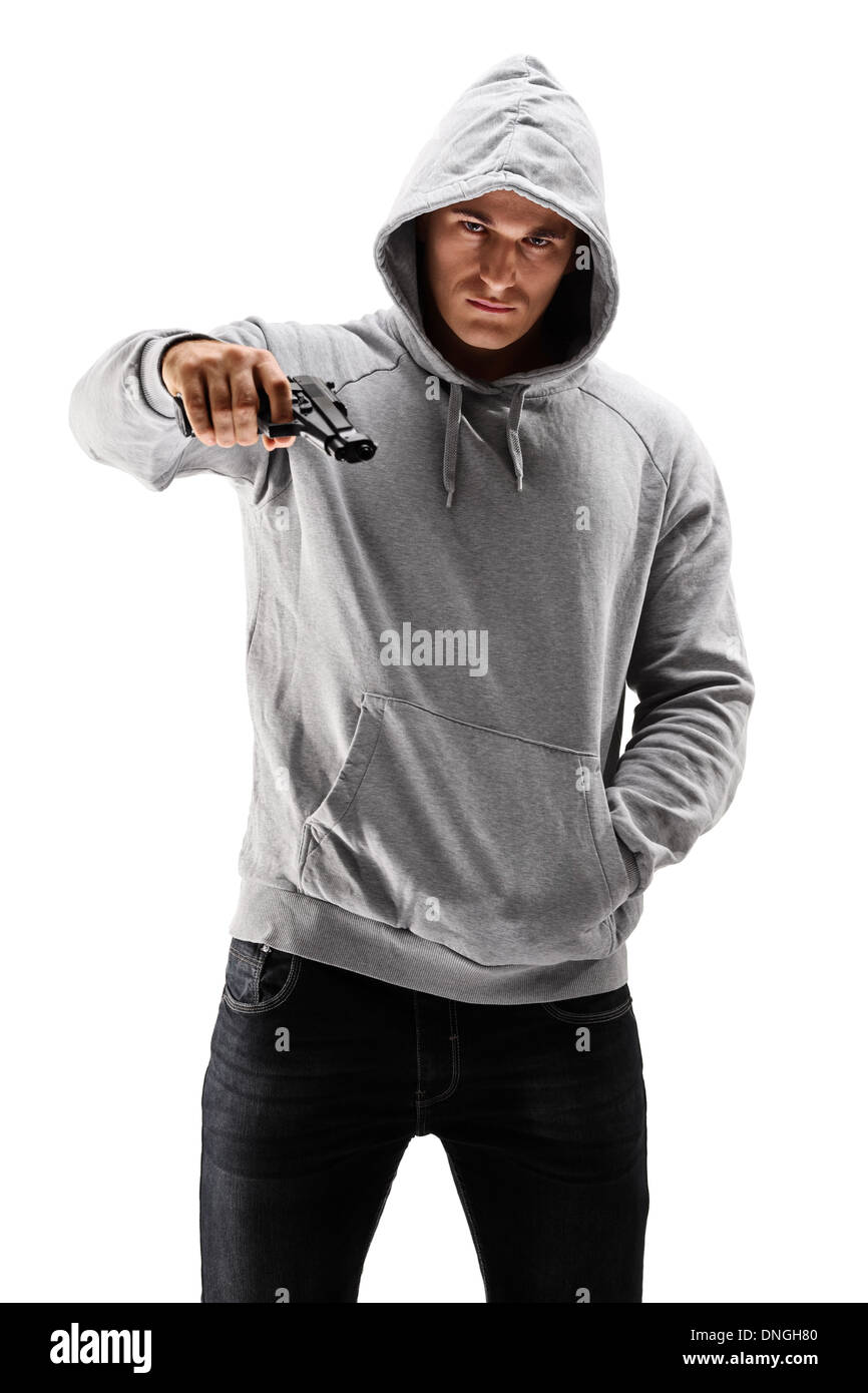 Young male with hood over his head holding a gun, symbolizing crime Stock Photo