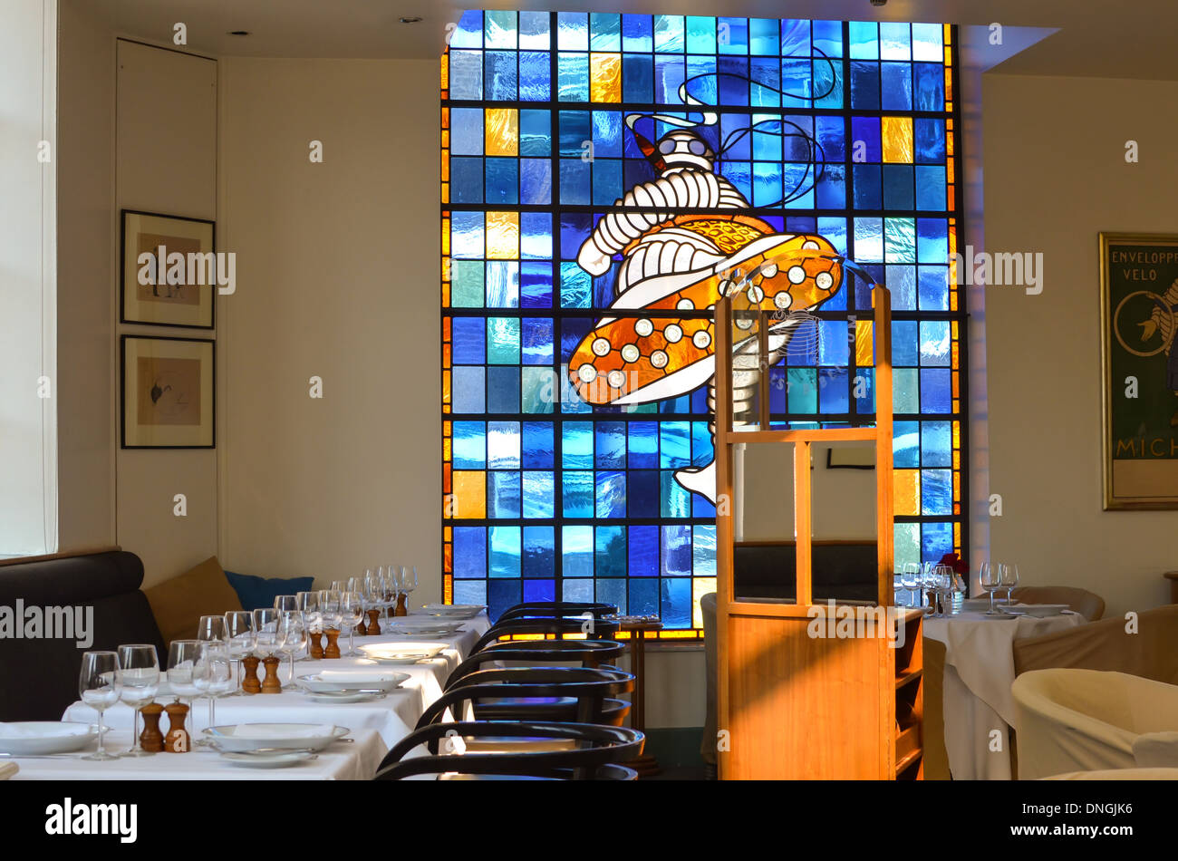 The Michelin Man, Bibendum depicted in a stained glass window in Bibendum Restaurant London Stock Photo