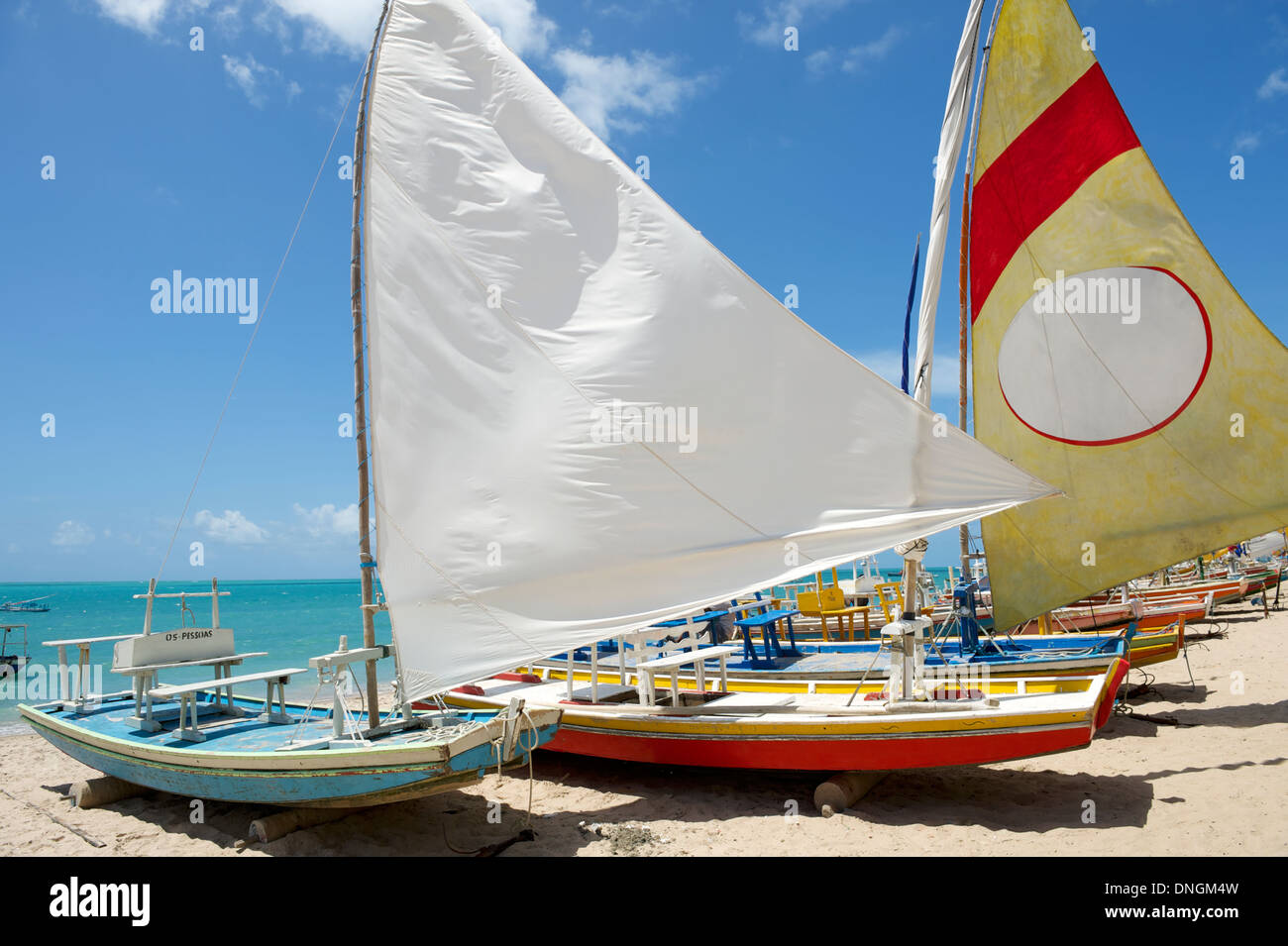 Traditional jangada sailboats lined up on Brazilian beach in Maceio Northeastern Brazil Stock Photo