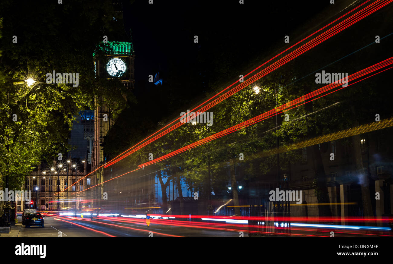 Light trails down Victoria Embankment to Big Ben and House of Parliament, London Stock Photo