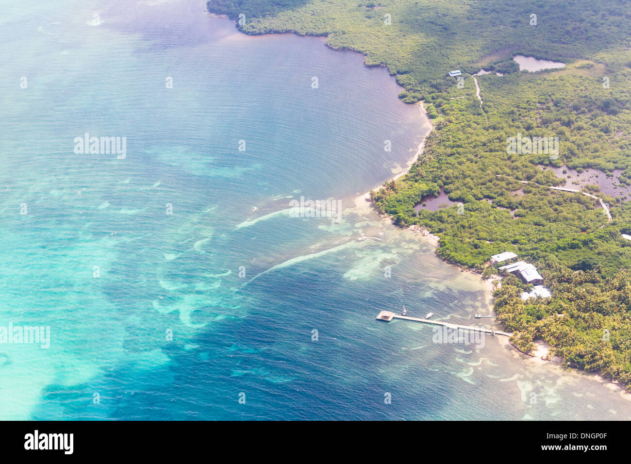 aerial view of the barrier reef of the coast of San Pedro, Belize. with small land masses or cayes Stock Photo