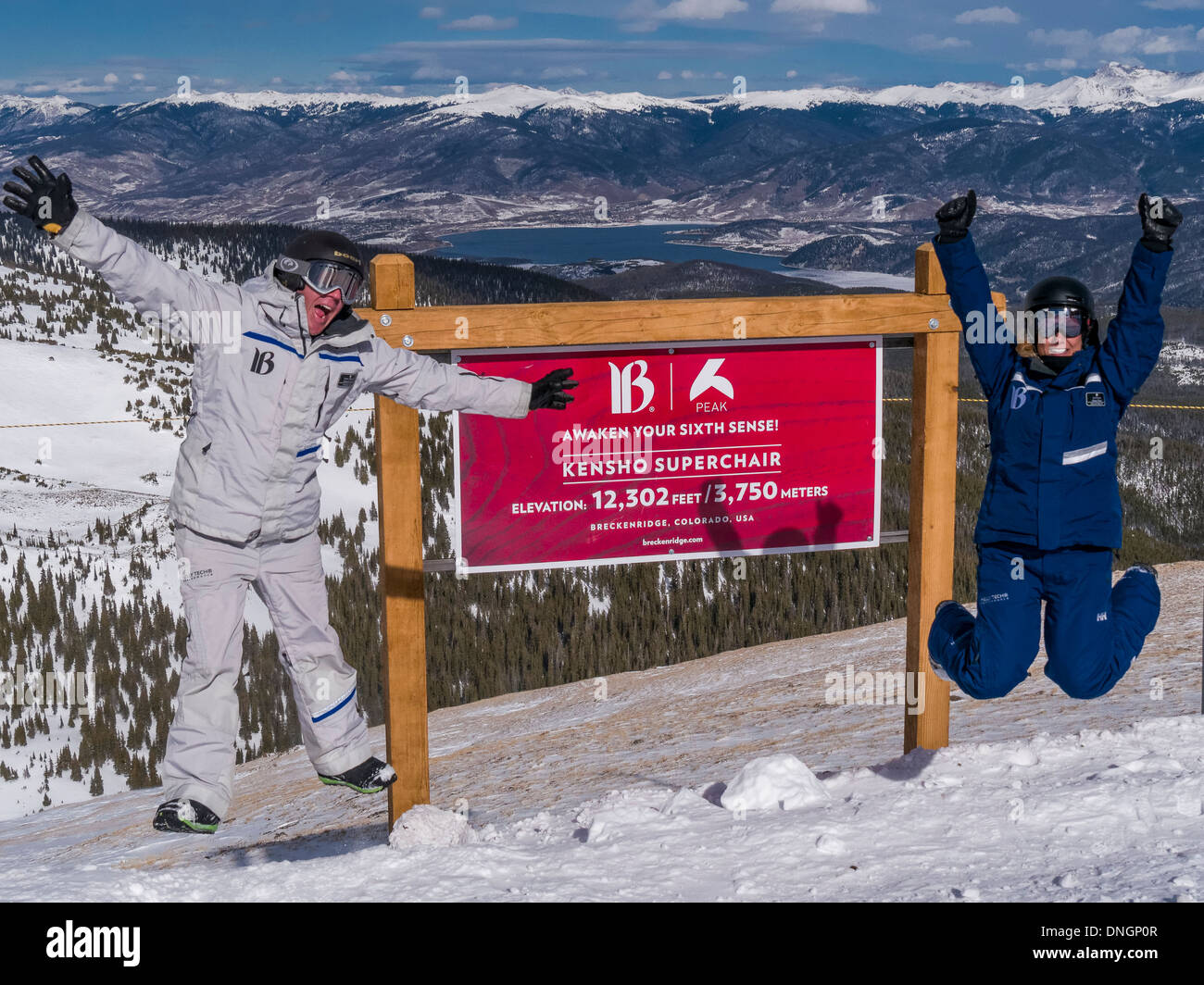 Kieran Cain and Alysa Hetze by the sign atop Peak 6, Breckenridge Ski Area, Breckenridge, Colorado. Stock Photo