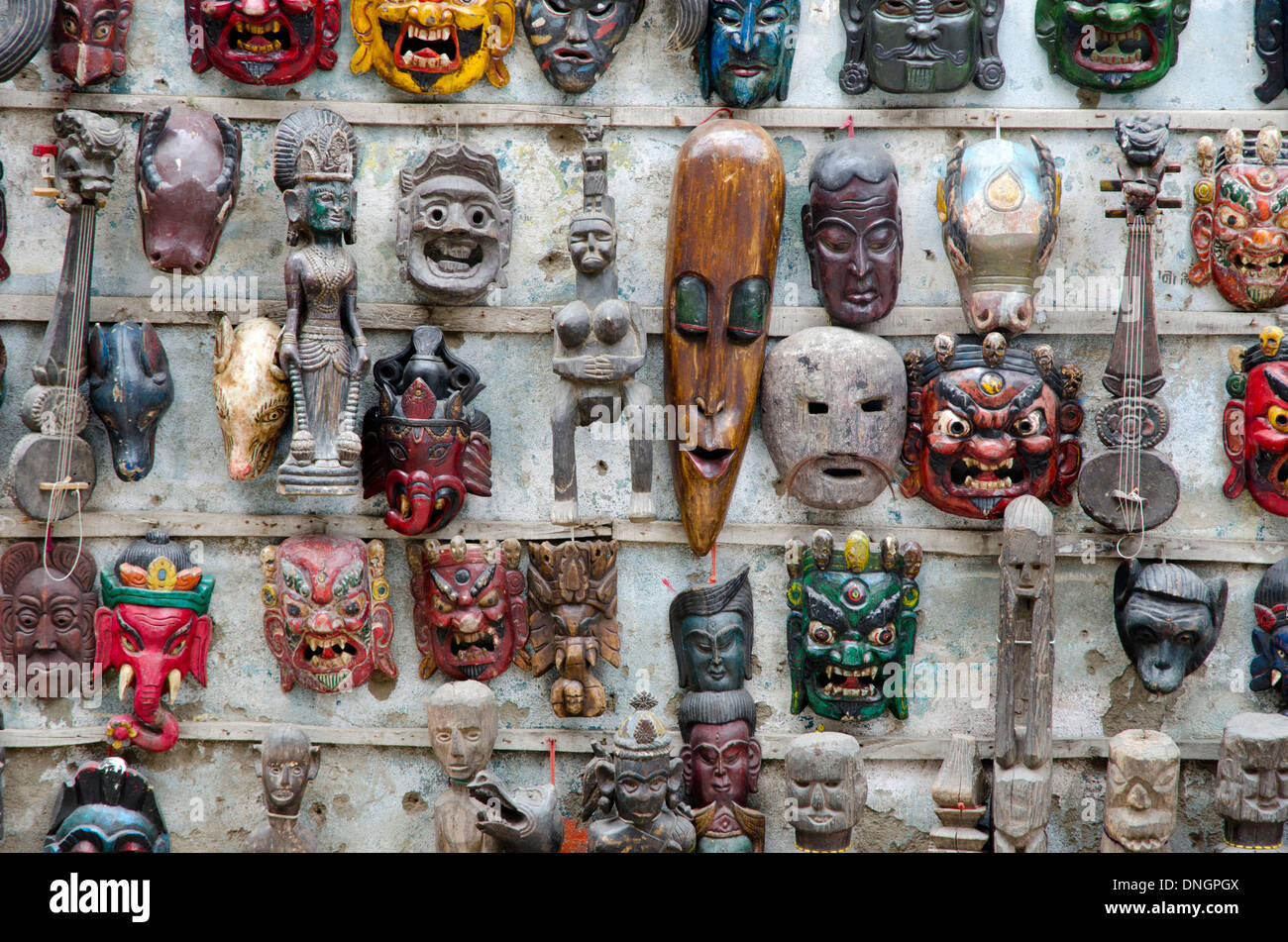 Traditional wooden ritual masks hanging on a wall in Kathmandu, Nepal