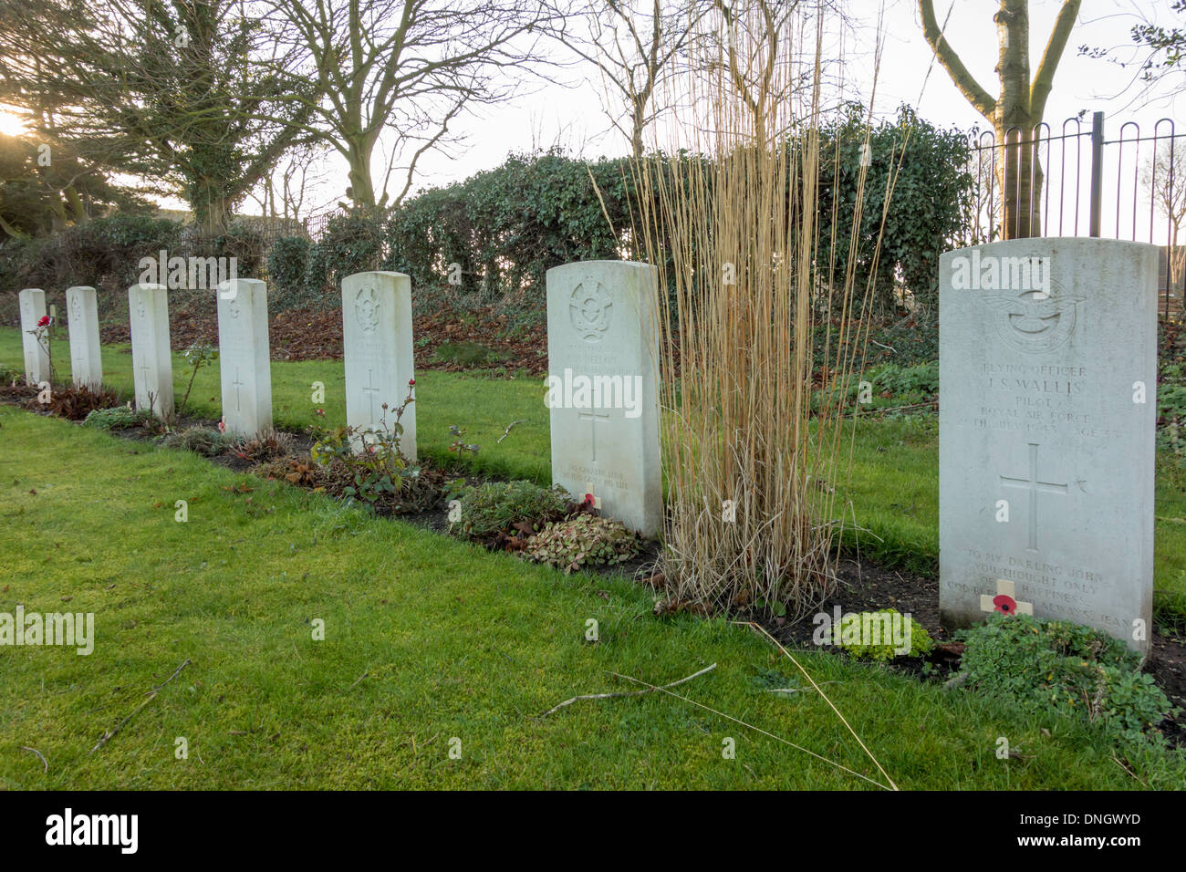 Part of row of 32 war graves of Allied Airmen killed in World War 2 and buried in churchyard at Brandesburton East Yorkshire UK Stock Photo