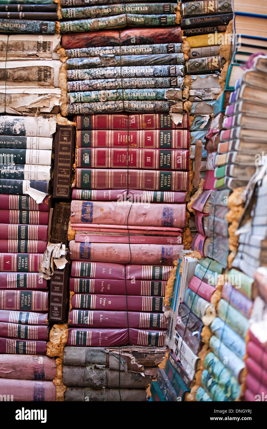 piles of many old italian books in second-hand bookseller shop Stock Photo