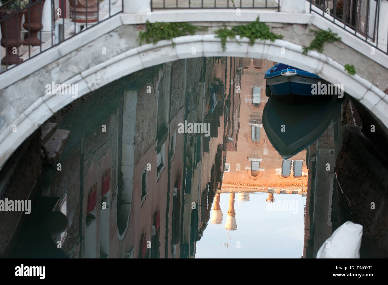 reflection of bridge and houses on Venetian canal water surface Stock ...