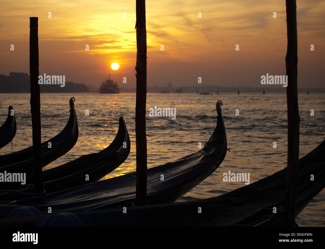 gondolas bows on sunset Venetian lagoon water and sky background Stock ...