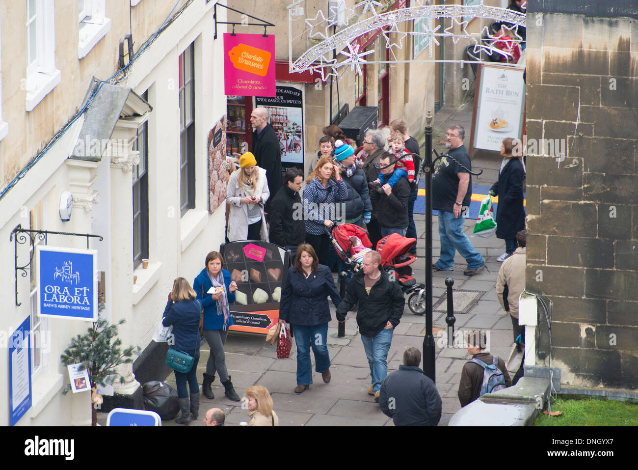 People shopping Christmas market and shops Bath Somerset Stock Photo