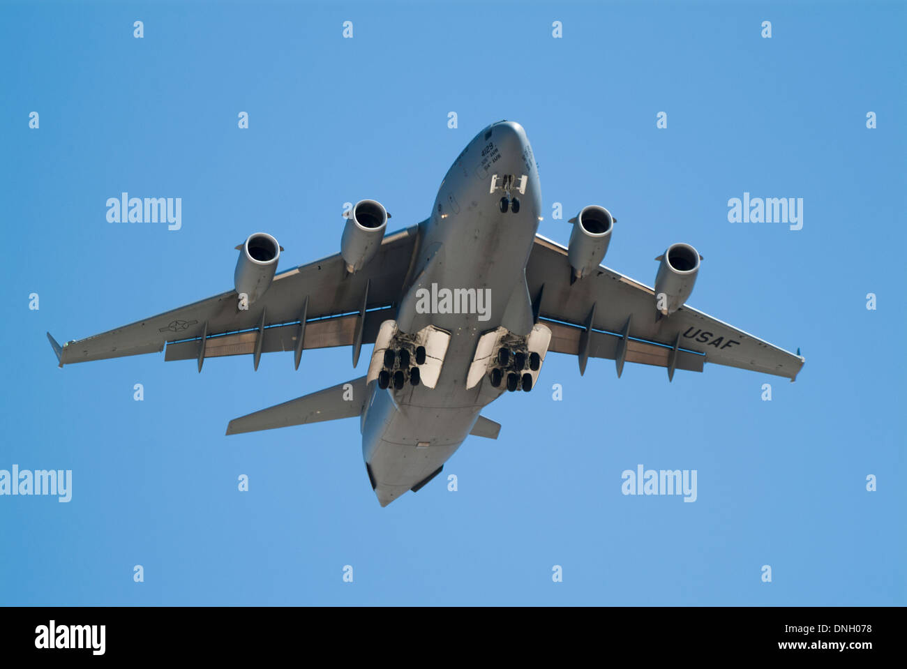 Boeing C17 Globemaster transport aircraft flying directly overhead with  landing gear down Stock Photo - Alamy