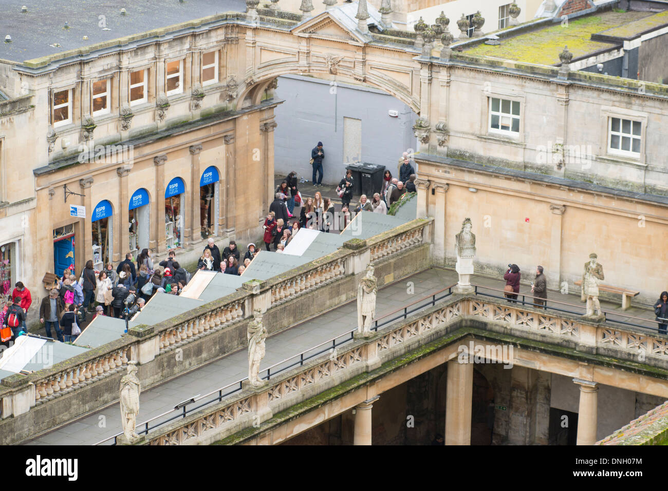 View across Bath roman baths with people shopping at Christmas market 2013 Stock Photo