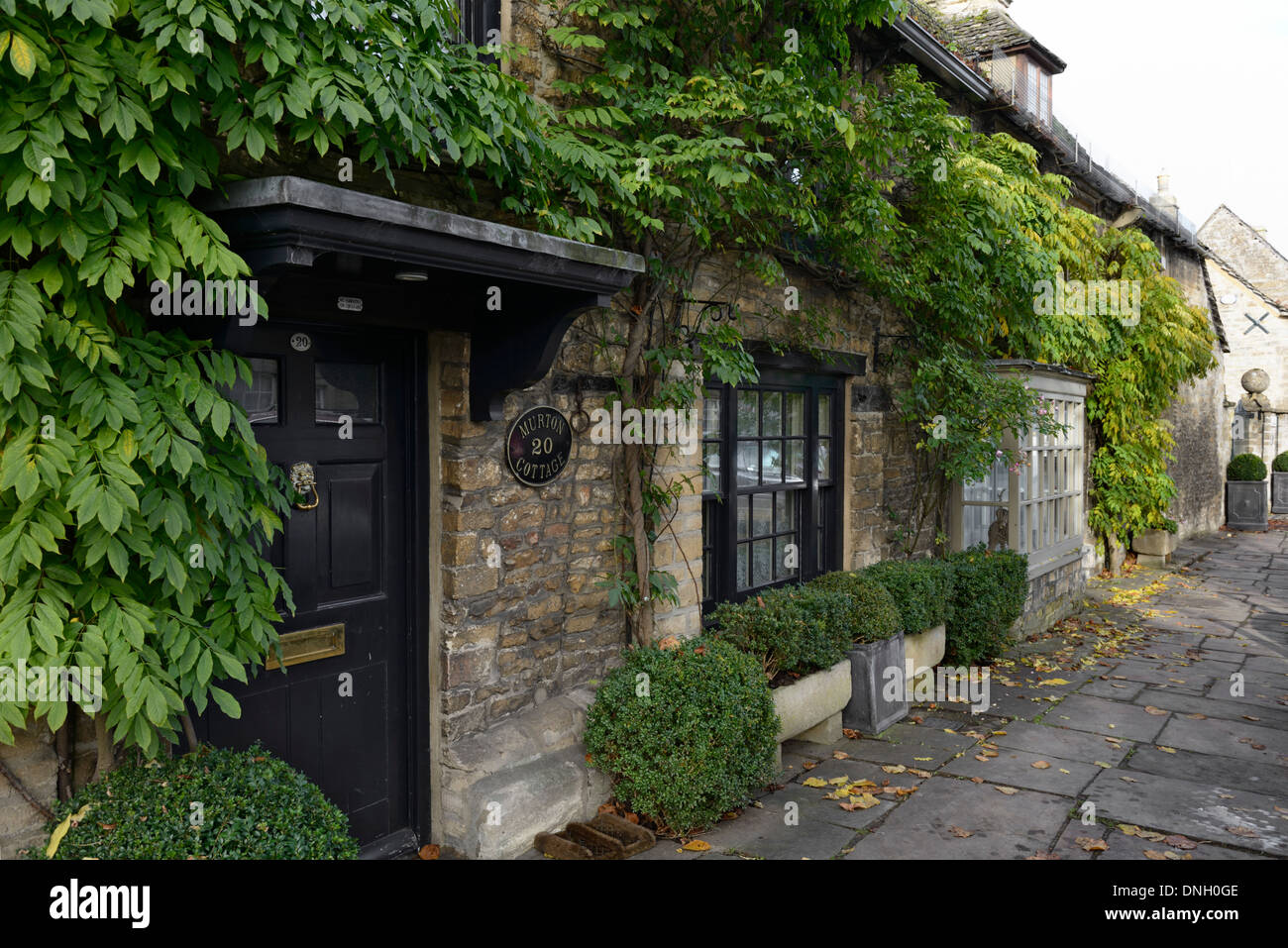 Row of old stone cottages, High Street, Burford, Cotswolds, Oxfordshire, England, United Kingdom, UK, Europe Stock Photo