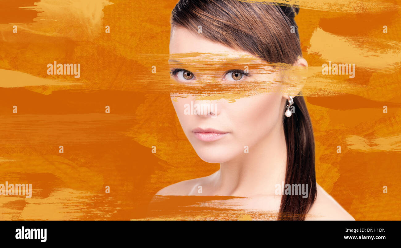 woman with orange paint Stock Photo