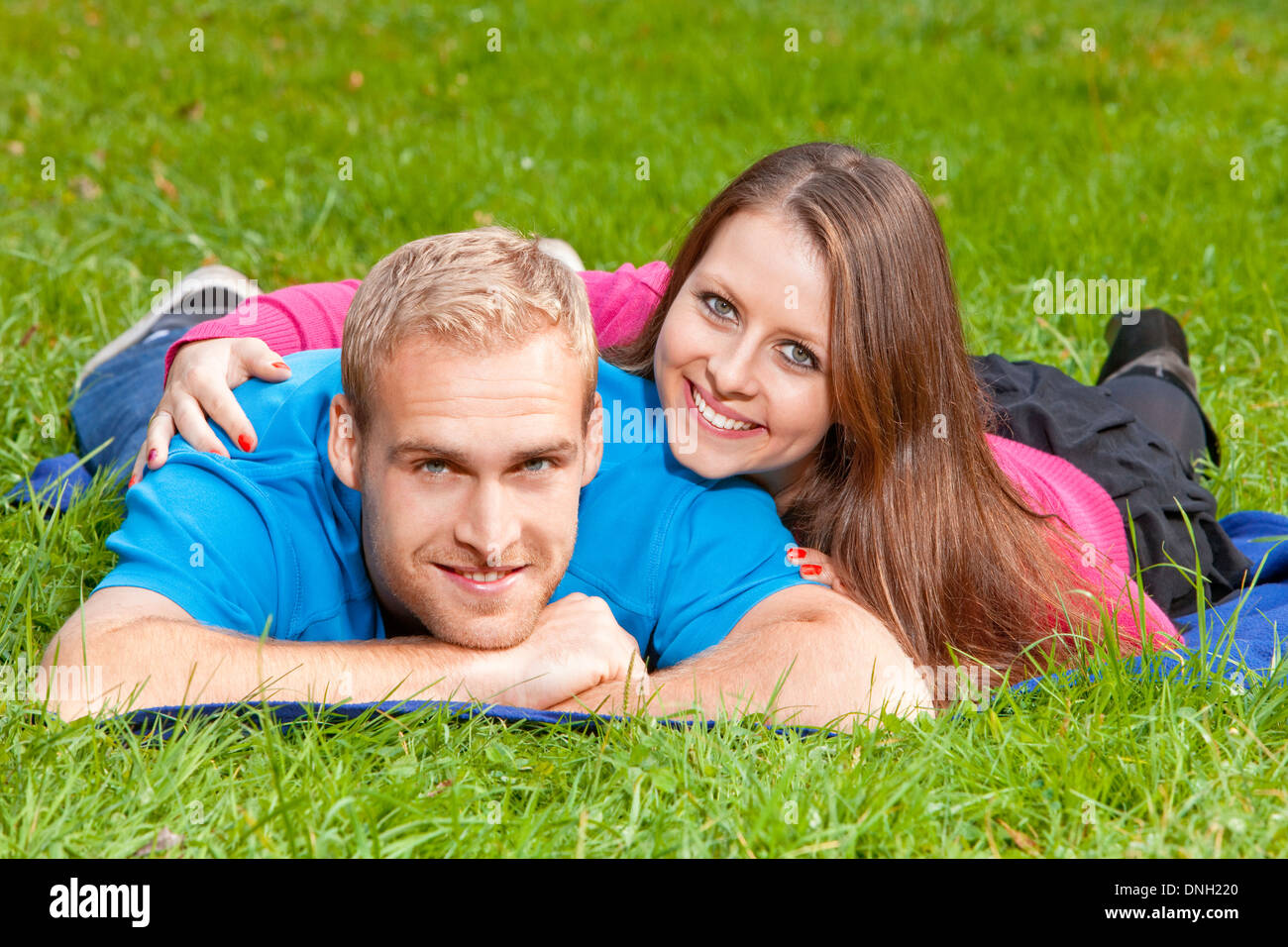 Portrait of a Happy Young Couple in the Park, Smiling Stock Photo - Alamy
