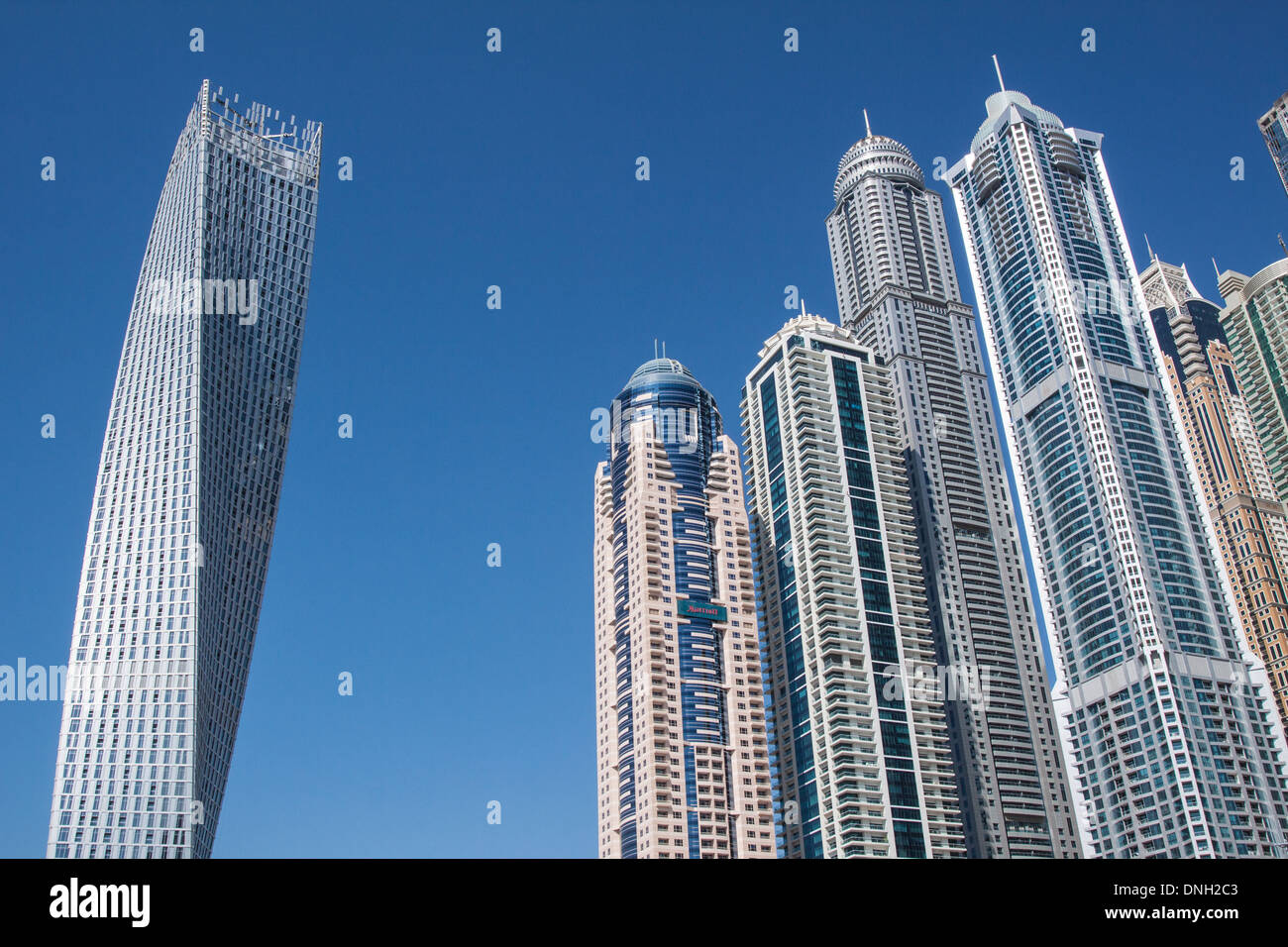 THE CAYAN TOWER, ALSO KNOWN AS THE INFINITY TOWER, AND OTHER BUILDINGS IN THE NEIGHBORHOOD OF THE DUBAI MARINA, DUBAI, UNITED ARAB EMIRATES, MIDDLE EAST Stock Photo