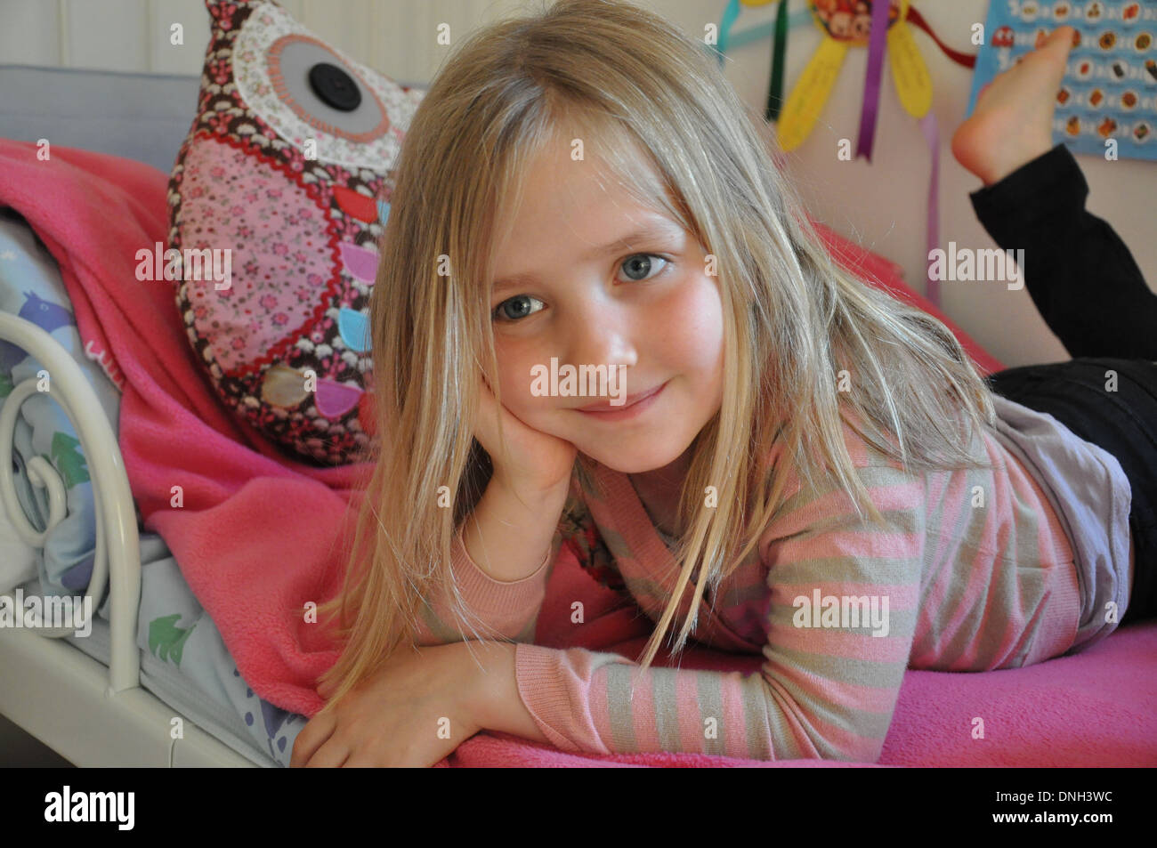 portrait of pretty blonde smiling girl aged 6 to 10 years Stock Photo