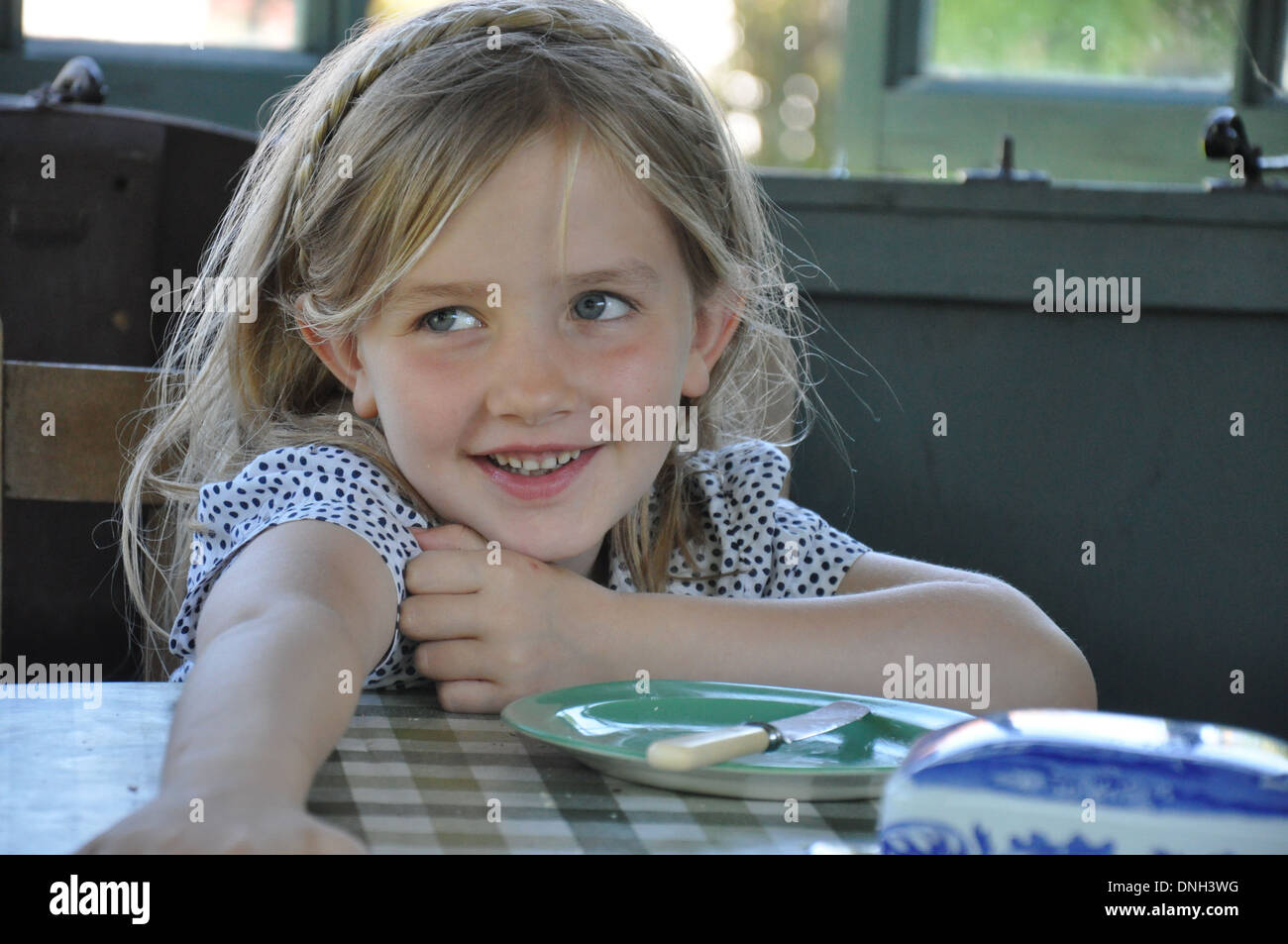 portrait of pretty blonde smiling girl aged 6 to 10 years Stock Photo