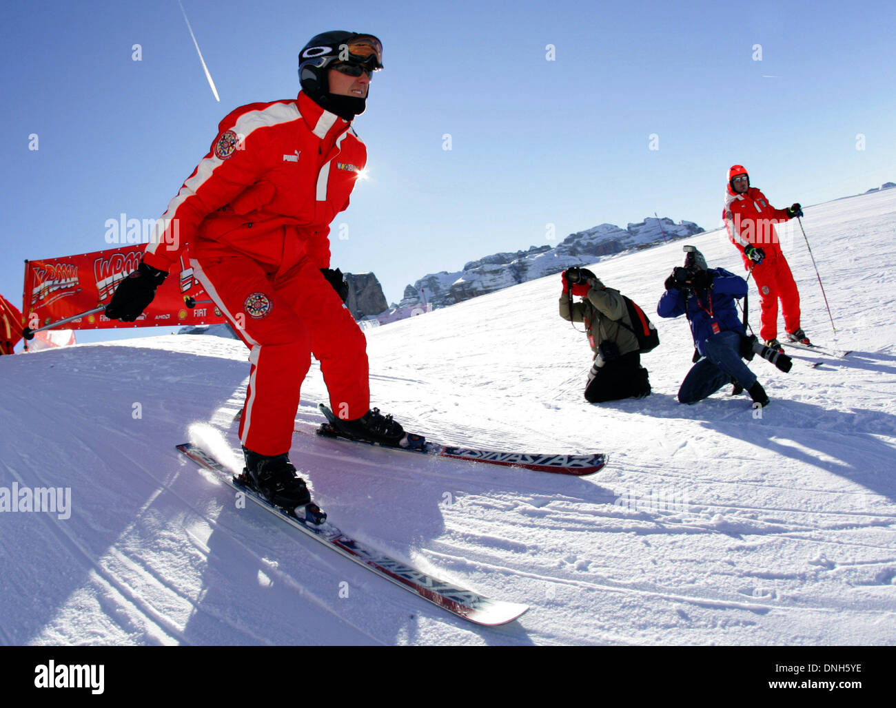FILE: German Formula One driver Michael Schumacher gets into carving position as he takes part in a 'Giant Slalom Ski Race' in Madonna di Campiglio, Italy, late Thursday 12 January 2006. Traditionally, in the beginning of the year the Ferrari team and the drivers spend one week of skiing themed 'Wrooom'. Photo: Rainer Jensendpa/Alamy Live News Stock Photo