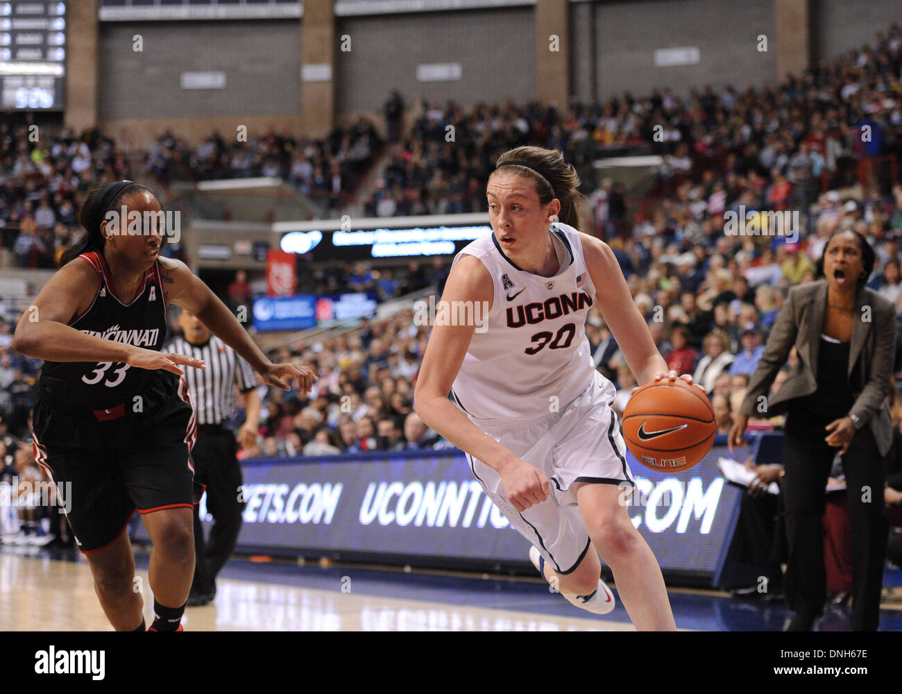 Storrs, CT, USA. 22nd Nov, 2013. Sunday December 29, 2013: UConn huskies guard-forward Breanna Stewart (30) drives to the basket against Cincinnati Bearcats forward Jeanise Randolph (33) during the 1st half of the womens NCAA basketball game between Cincinnati and Connecticut at Gampel Pavilion in Storrs, CT. Bill Shettle / Cal Sport Media. © csm/Alamy Live News Stock Photo