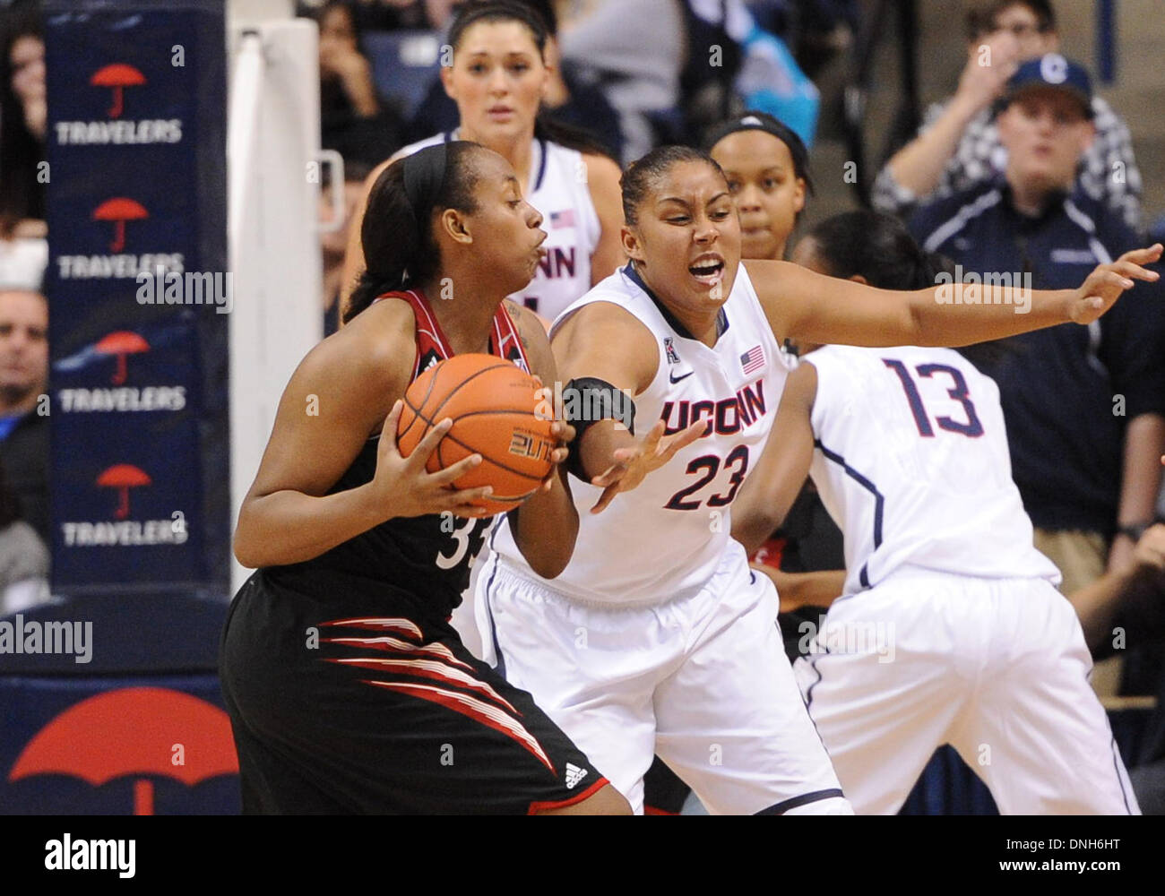Storrs, CT, USA. 22nd Nov, 2013. Sunday December 29, 2013: Cincinnati Bearcats forward Jeanise Randolph (33) gets to a loose ball in front of UConn huskies guard-forward Kaleena Mosqueda Lewis (23) during the 2nd half of the womens NCAA basketball game between Cincinnati and Connecticut at Gampel Pavilion in Storrs, CT. UConn beat Cincinnati easily 67-34.Bill Shettle / Cal Sport Media. © csm/Alamy Live News Stock Photo