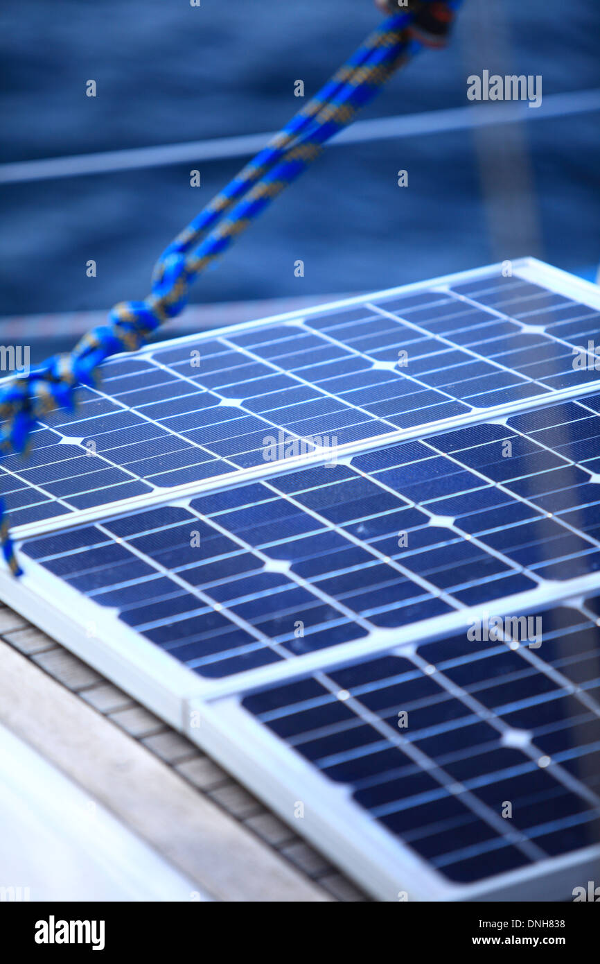 Solar charging batteries aboard a sail boat. Photovoltaic panels
