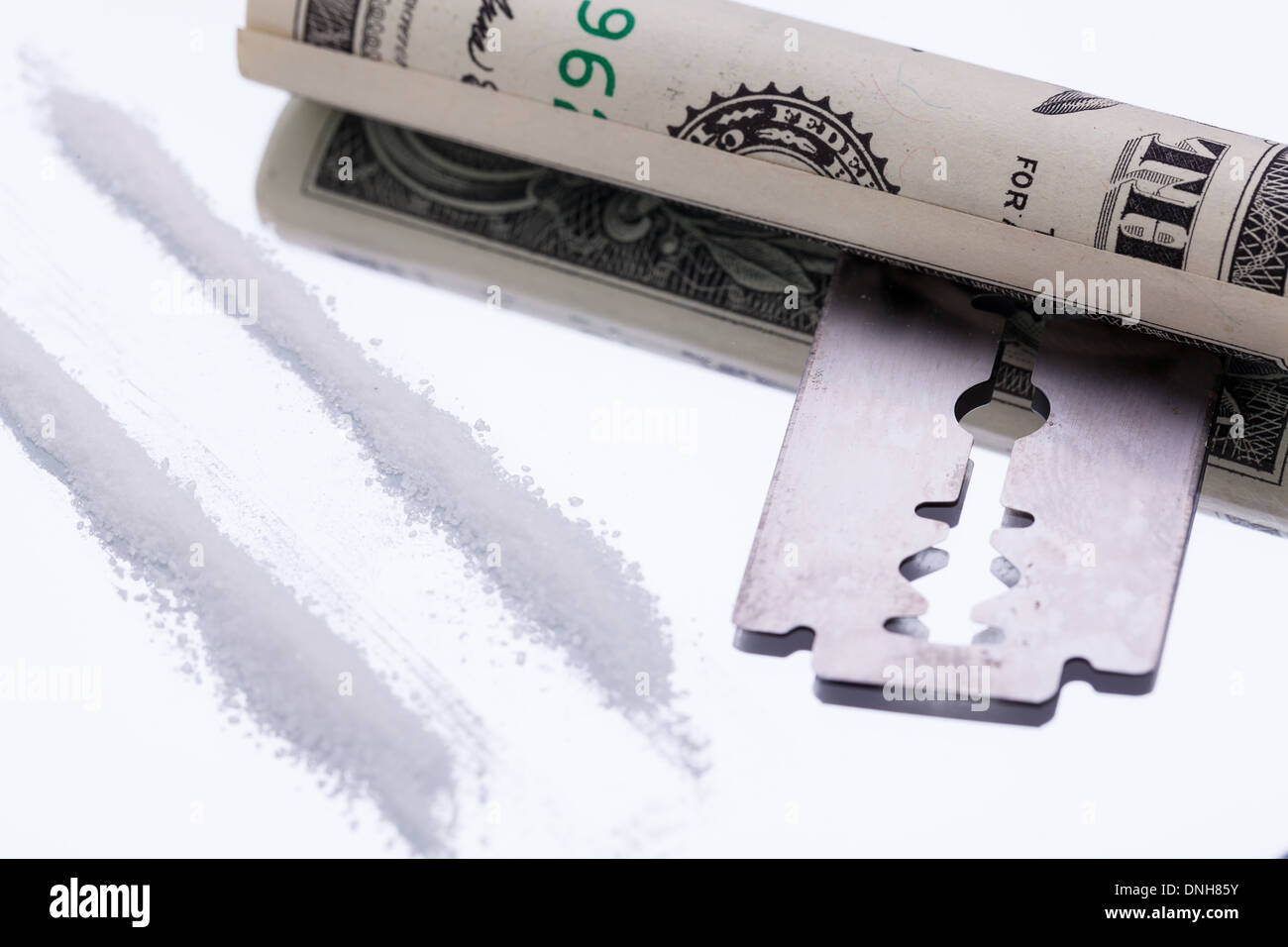 cocaine lines on mirror with razor blade drugs objects macro closeup Stock Photo