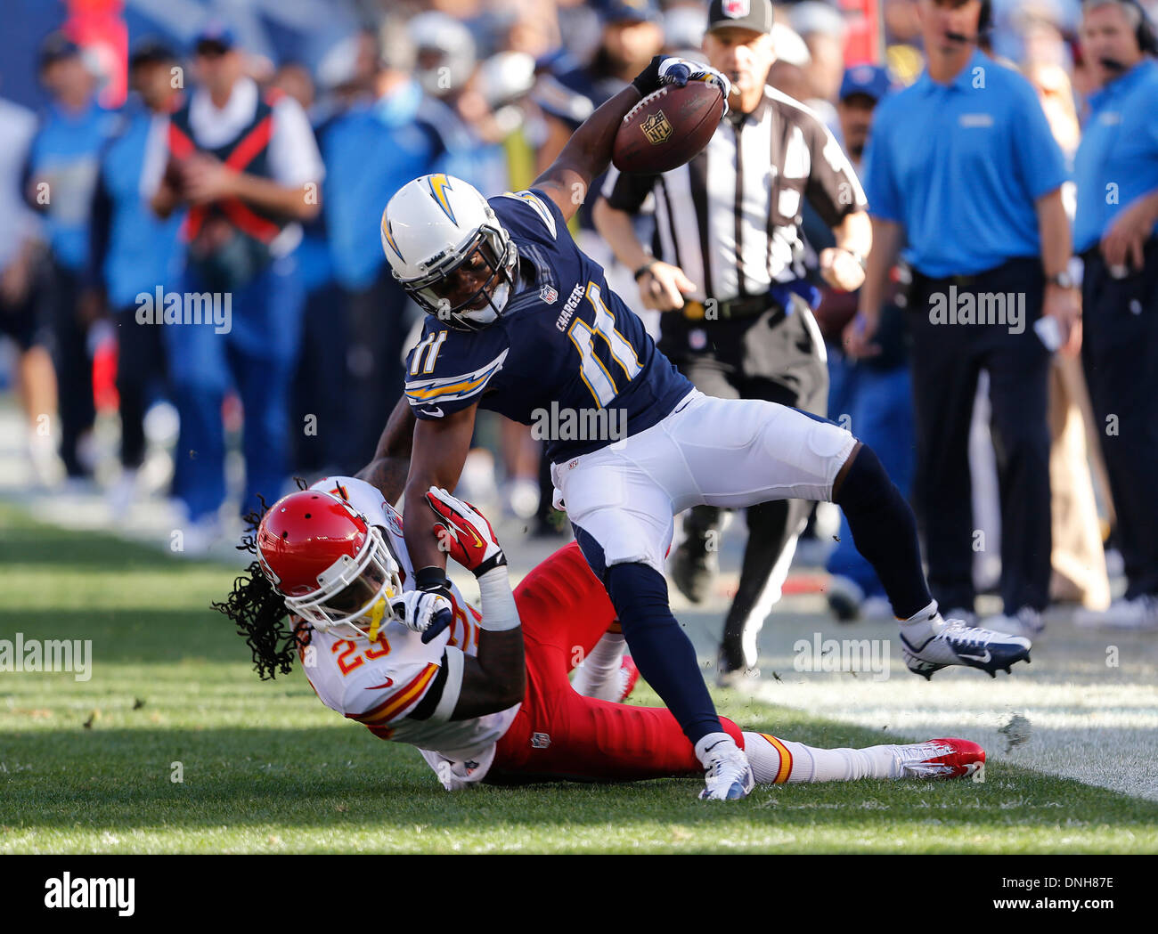 San Diego, California, USA. 29th Dec, 2013. Dec. 29, 2013 San Diego, California USA | Chargers receiver Eddie Royal gets taken down by Chiefs safety Kendrick Lewis after his 30 yard catch and run as the Chargers took on the Kansas City Chiefs at Qualcomm Stadium Sunday afternoon. | Mandatory Photo Credit: Photo by Earnie Grafton/UT San Diego/Copyright 2013 San Diego Union-Tribune, LLC Credit:  U-T San Diego/ZUMAPRESS.com/Alamy Live News Stock Photo