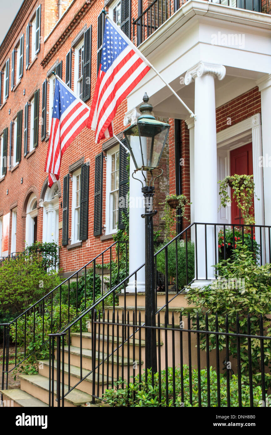 Colonial Red Brick Architecture with American Flags Stock Photo