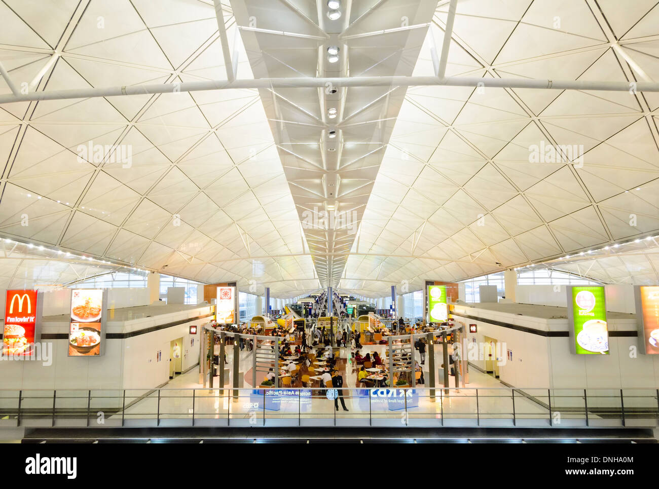 Modern international contemporary airport passenger concourse building ceiling / roof: Hong Kong International Airport. Stock Photo