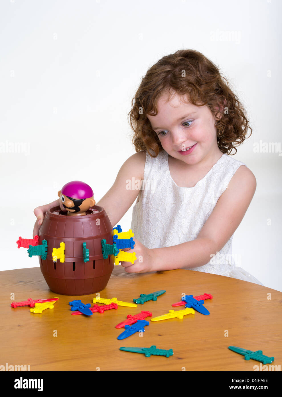 Young girl playing Pop-up Pirate game by Hasbro Stock Photo - Alamy